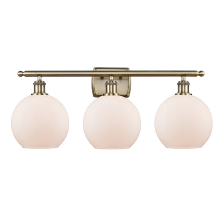 A large image of the Innovations Lighting 516-3W-13-26 Athens Vanity Antique Brass / Matte White