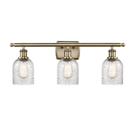 A large image of the Innovations Lighting 516-3W-12-26 Caledonia Vanity Mica / Antique Brass