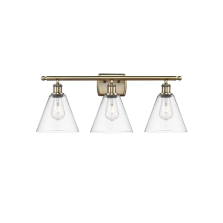 A large image of the Innovations Lighting 516-3W-11-28 Berkshire Vanity Antique Brass / Clear