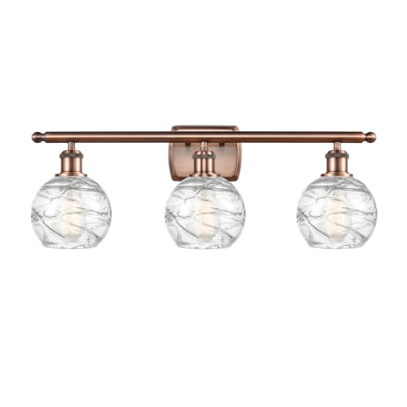 A large image of the Innovations Lighting 516-3W Small Deco Swirl Antique Copper / Clear
