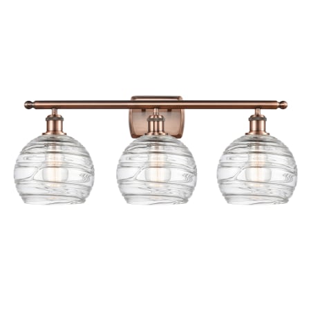 A large image of the Innovations Lighting 516-3W Deco Swirl Antique Copper / Clear