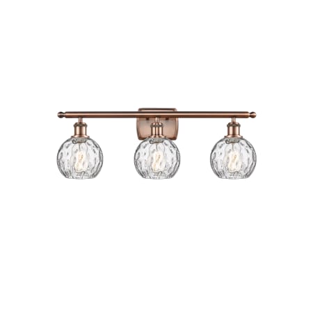 A large image of the Innovations Lighting 516-3W-11-26 Athens Vanity Antique Copper / Clear Water Glass