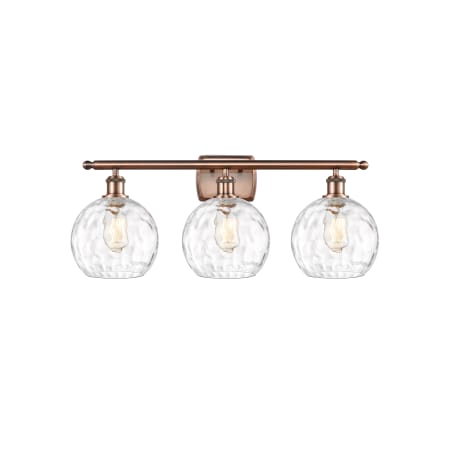A large image of the Innovations Lighting 516-3W-13-26 Athens Vanity Antique Copper / Clear Water Glass