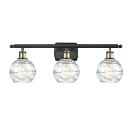 A large image of the Innovations Lighting 516-3W Small Deco Swirl Black Antique Brass / Clear