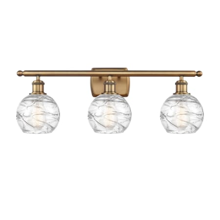 A large image of the Innovations Lighting 516-3W Small Deco Swirl Brushed Brass / Clear