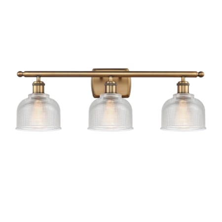 A large image of the Innovations Lighting 516-3W Dayton Brushed Brass / Clear