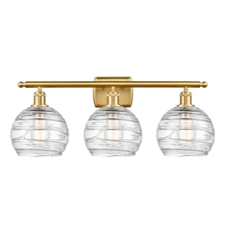 A large image of the Innovations Lighting 516-3W-11-26-L Athens Vanity Clear Deco Swirl / Satin Gold