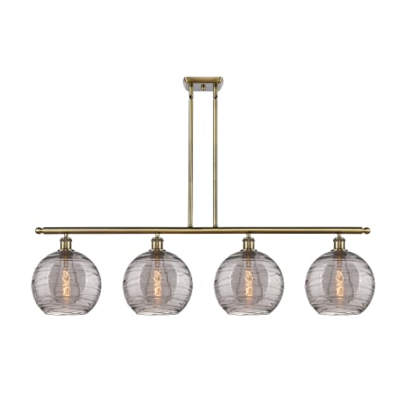 A large image of the Innovations Lighting 516-4I 12 48 Athens Deco Swirl Chandelier Antique Brass / Light Smoke Deco Swirl