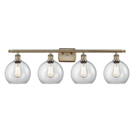 A large image of the Innovations Lighting 516-4W-11-36 Athens Vanity Antique Brass / Clear