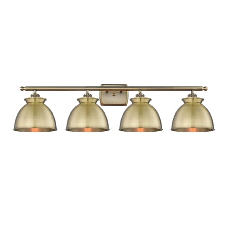 A large image of the Innovations Lighting 516-4W-12-38 Adirondack Vanity Antique Brass