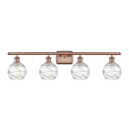 A large image of the Innovations Lighting 516-4W Small Deco Swirl Antique Copper / Clear