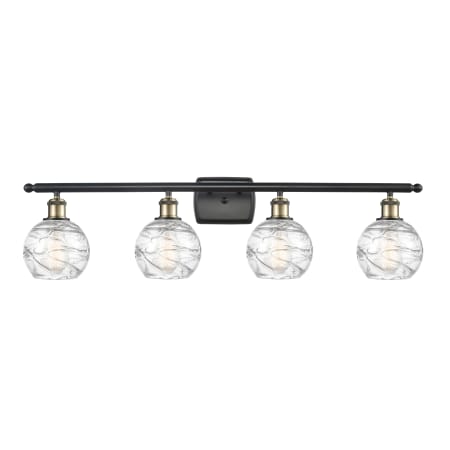 A large image of the Innovations Lighting 516-4W Small Deco Swirl Black Antique Brass / Clear