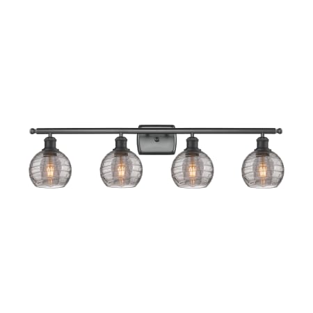 A large image of the Innovations Lighting 516-4W 9 36 Athens Deco Swirl Vanity Matte Black / Light Smoke Deco Swirl