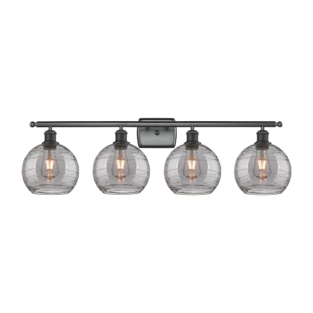 A large image of the Innovations Lighting 516-4W 11 38 Athens Deco Swirl Vanity Matte Black / Light Smoke Deco Swirl