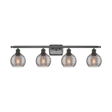 A large image of the Innovations Lighting 516-4W 9 36 Athens Deco Swirl Vanity Oil Rubbed Bronze / Light Smoke Deco Swirl