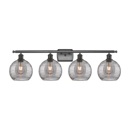 A large image of the Innovations Lighting 516-4W 11 38 Athens Deco Swirl Vanity Oil Rubbed Bronze / Light Smoke Deco Swirl