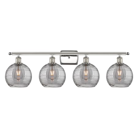 A large image of the Innovations Lighting 516-4W 11 38 Athens Deco Swirl Vanity Polished Nickel / Light Smoke Deco Swirl