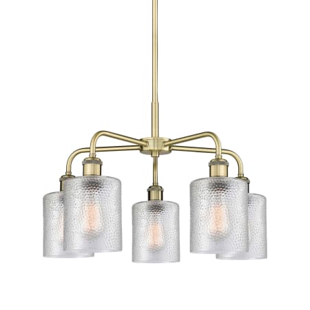 A large image of the Innovations Lighting 516-5CR-15-23 Cobbleskill Chandelier Antique Brass / Clear