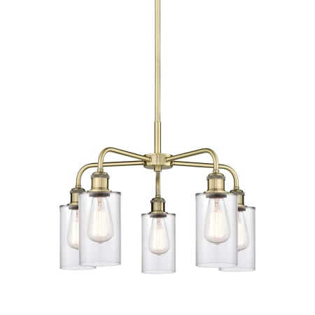 A large image of the Innovations Lighting 516-5CR-15-22 Clymer Chandelier Antique Brass / Clear