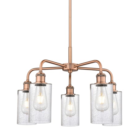 A large image of the Innovations Lighting 516-5CR-15-22 Clymer Chandelier Antique Copper / Seedy