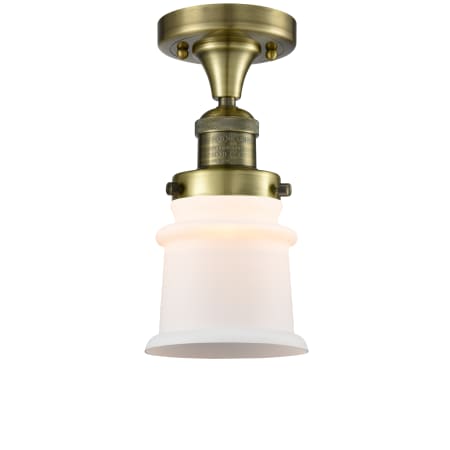 A large image of the Innovations Lighting 517-1CH Small Canton Antique Brass / Matte White Cased
