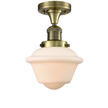 A large image of the Innovations Lighting 517-1CH Small Oxford Antique Brass / Matte White Cased
