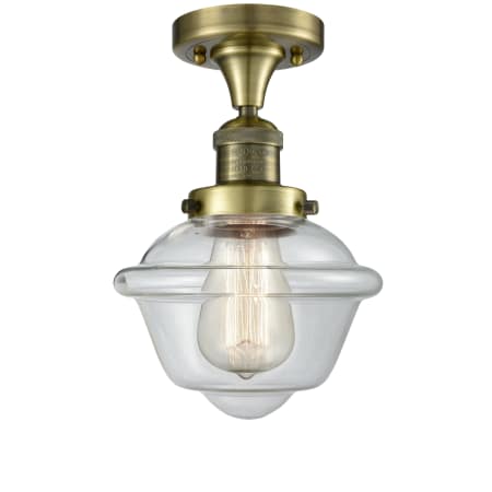 A large image of the Innovations Lighting 517-1CH Small Oxford Antique Brass / Clear