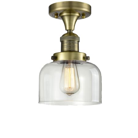 A large image of the Innovations Lighting 517-1CH / Large Bell Antique Brass / Clear