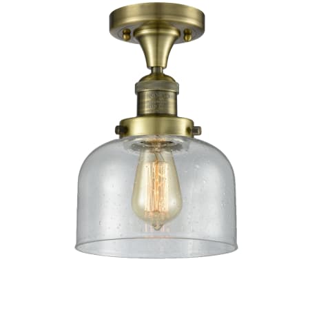 A large image of the Innovations Lighting 517-1CH / Large Bell Antique Brass / Seedy