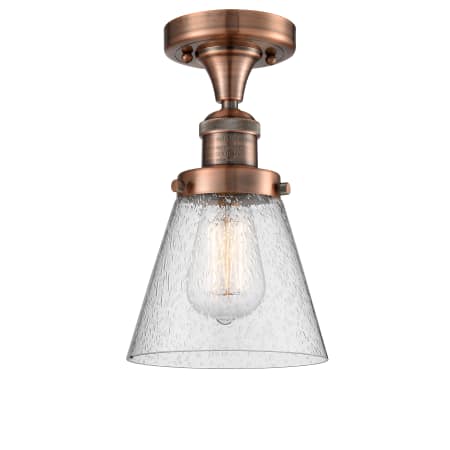 A large image of the Innovations Lighting 517-1CH Small Cone Antique Copper / Seedy