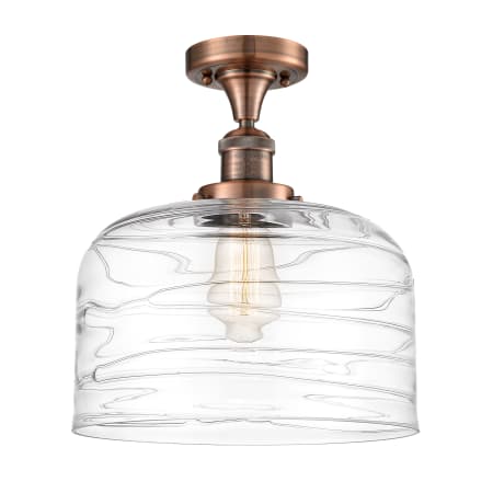 A large image of the Innovations Lighting 517-1CH-12-12-L Bell Semi-Flush Antique Copper / Clear Deco Swirl
