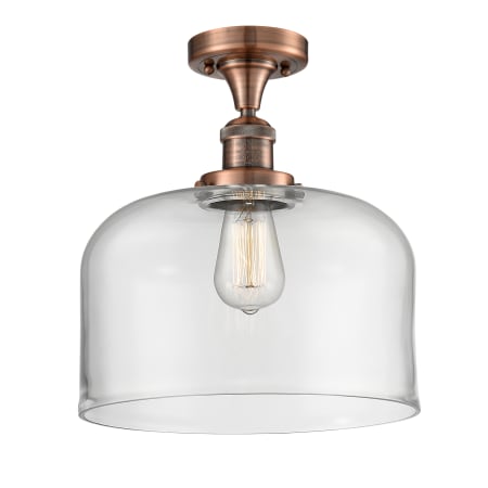 A large image of the Innovations Lighting 517 X-Large Bell Antique Copper / Clear