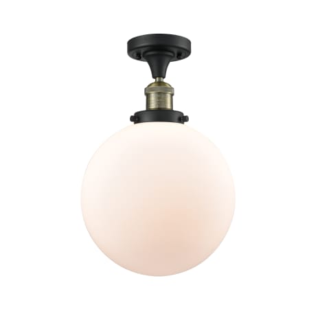 A large image of the Innovations Lighting 517 X-Large Beacon Black Antique Brass / Matte White