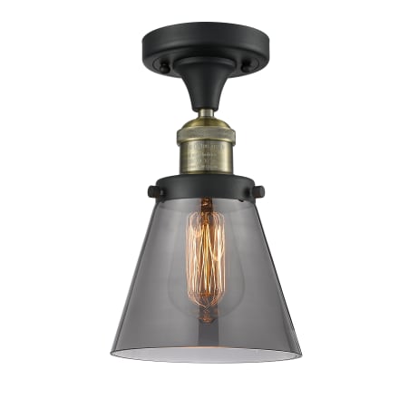 A large image of the Innovations Lighting 517-1CH Small Cone Black Antique Brass / Smoked