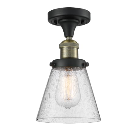 A large image of the Innovations Lighting 517-1CH Small Cone Black Antique Brass / Seedy