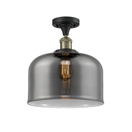 A large image of the Innovations Lighting 517 X-Large Bell Black Antique Brass / Plated Smoke
