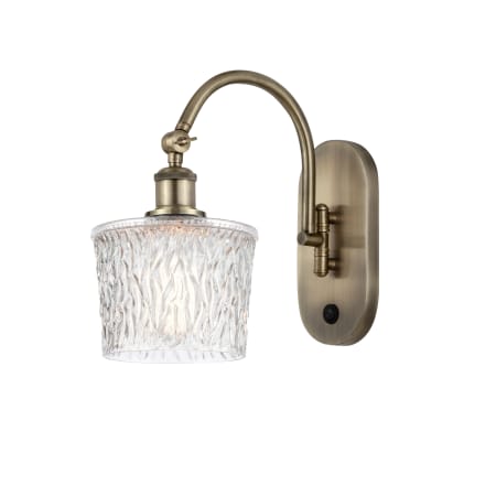 A large image of the Innovations Lighting 518-1W-12-7 Niagra Sconce Antique Brass / Clear