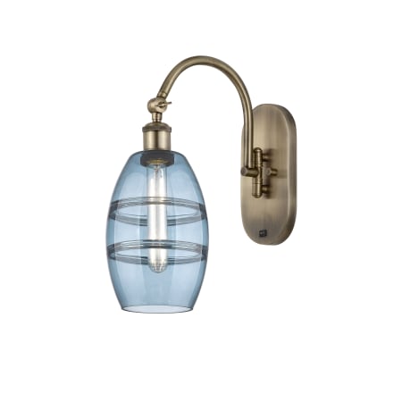 A large image of the Innovations Lighting 518-1W-12-6 Vaz Sconce Antique Brass / Blue