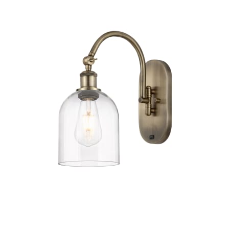 A large image of the Innovations Lighting 518-1W-13-6 Bella Sconce Antique Brass / Clear