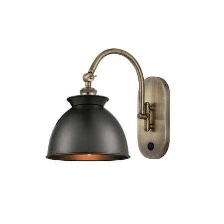 A large image of the Innovations Lighting 518-1W-13-9 Adirondack Sconce Antique Brass / Matte Black
