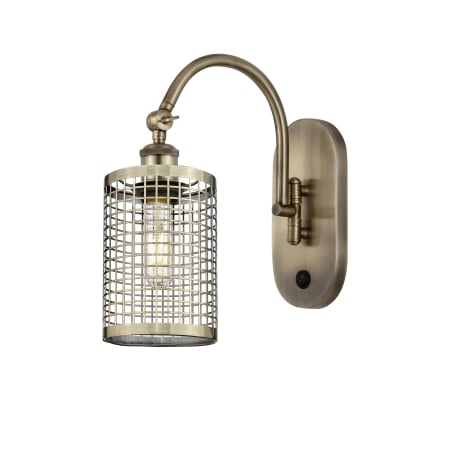 A large image of the Innovations Lighting 518-1W-13-5 Nestbrook Sconce Antique Brass