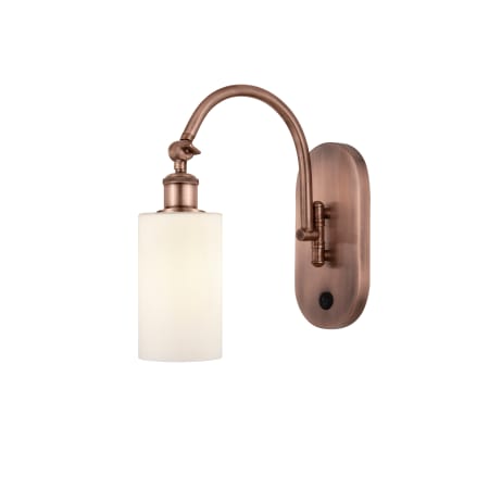 A large image of the Innovations Lighting 518-1W-13-6 Clymer Sconce Antique Copper / Matte White