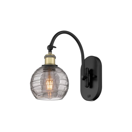 A large image of the Innovations Lighting 518-1W 12 6 Athens Deco Swirl Sconce Black Antique Brass / Light Smoke Deco Swirl