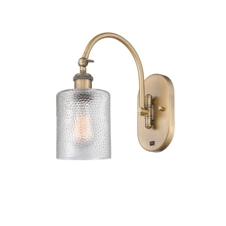 A large image of the Innovations Lighting 518-1W-13-5 Cobbleskill Sconce Brushed Brass / Clear