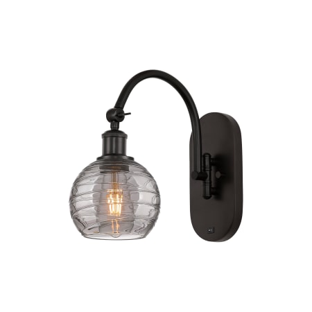 A large image of the Innovations Lighting 518-1W 12 6 Athens Deco Swirl Sconce Oil Rubbed Bronze / Light Smoke Deco Swirl