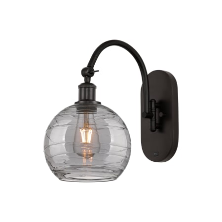 A large image of the Innovations Lighting 518-1W 13 8 Athens Deco Swirl Sconce Oil Rubbed Bronze / Light Smoke Deco Swirl