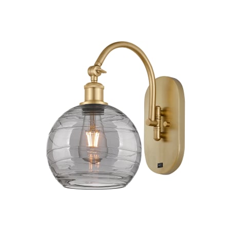 A large image of the Innovations Lighting 518-1W 13 8 Athens Deco Swirl Sconce Satin Gold / Light Smoke Deco Swirl