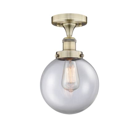 A large image of the Innovations Lighting 616-1F-9-8 Beacon Semi-Flush Antique Brass / Clear