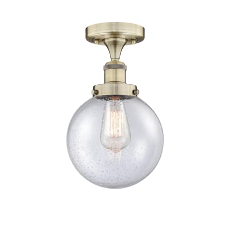 A large image of the Innovations Lighting 616-1F-9-8 Beacon Semi-Flush Antique Brass / Seedy