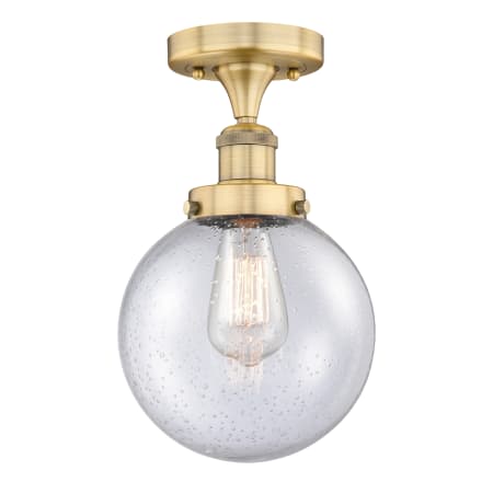 A large image of the Innovations Lighting 616-1F-9-8 Beacon Semi-Flush Brushed Brass / Seedy